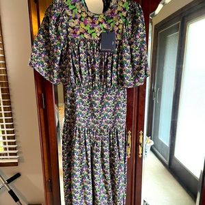 Louis Vuitton Floral Dress. Sequined top with 2 slots. Floor length gown.